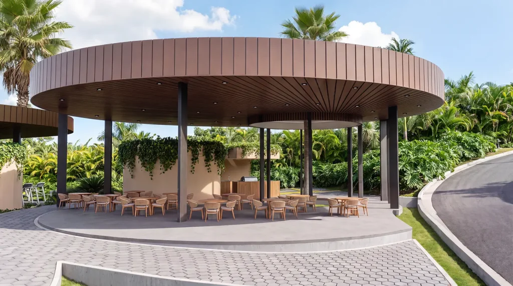 Salon social al aire libre bajo cubierta circular de madera, con mesas y asador